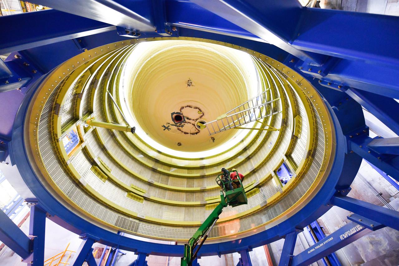 The Space Launch System (SLS) rocket’s liquid oxygen tank structural test article was manufactured and stacked in June 2019 at NASA’s Michoud Assembly Facility in New Orleans. To construct the test article, Boeing technicians at Michoud moved the liquid oxygen tank to the Vertical Assemby Building stacking and integration area. Here, they added simulators to mimic the two structures that connect to the tank, the intertank and the forward skirt.  This structural hardware for the SLS core stage for America’s new deep space rocket is structurally identical to the flight version of the tank. It will be shipped on the Pegasus barge to NASA’s Marshall Space Flight Center in Hunstville, Alabama, where it will undergo a series of tests that simulate the stresses and loads of liftoff and flight. These tests will help ensure designs are adequate for successful SLS missions to the Moon and beyond. The flight liquid oxygen tank along with the liquid hydrogen tank supplies more than 500,000 gallons of propellant to the core stages four RS-25 engines, which produce 2 million pounds of thrust to help send the SLS rocket to space.